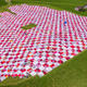 Illustration for article titled The Worlds Biggest Picnic Blanket Is Growing in the Swiss Countryside